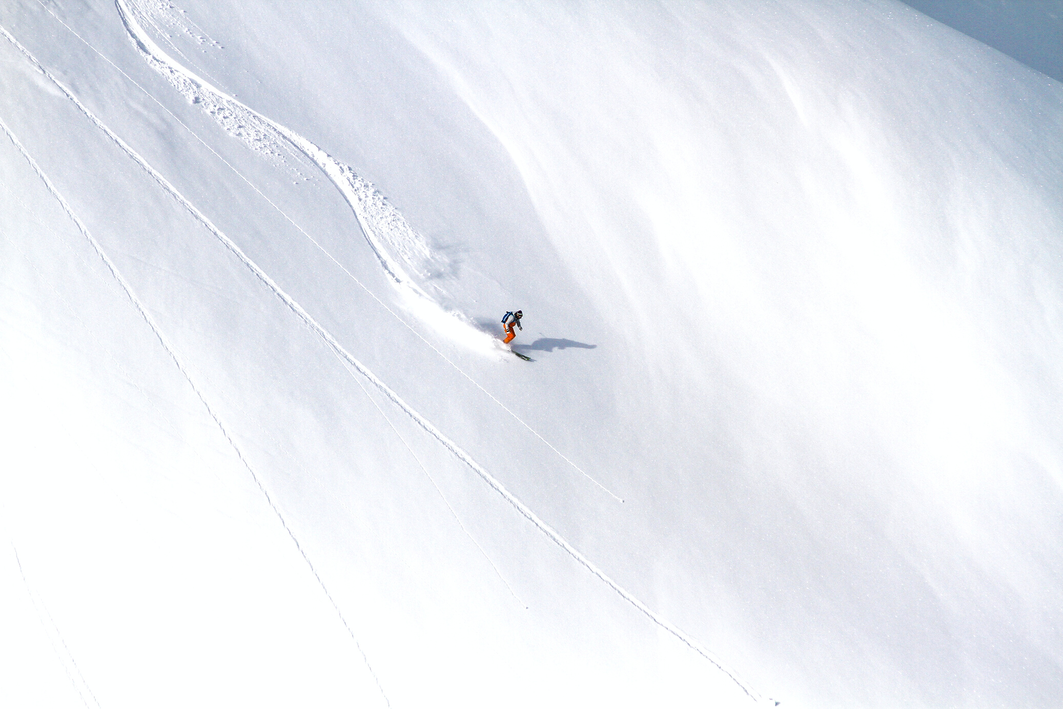 A Person Skiing on Snow Covered Mountain